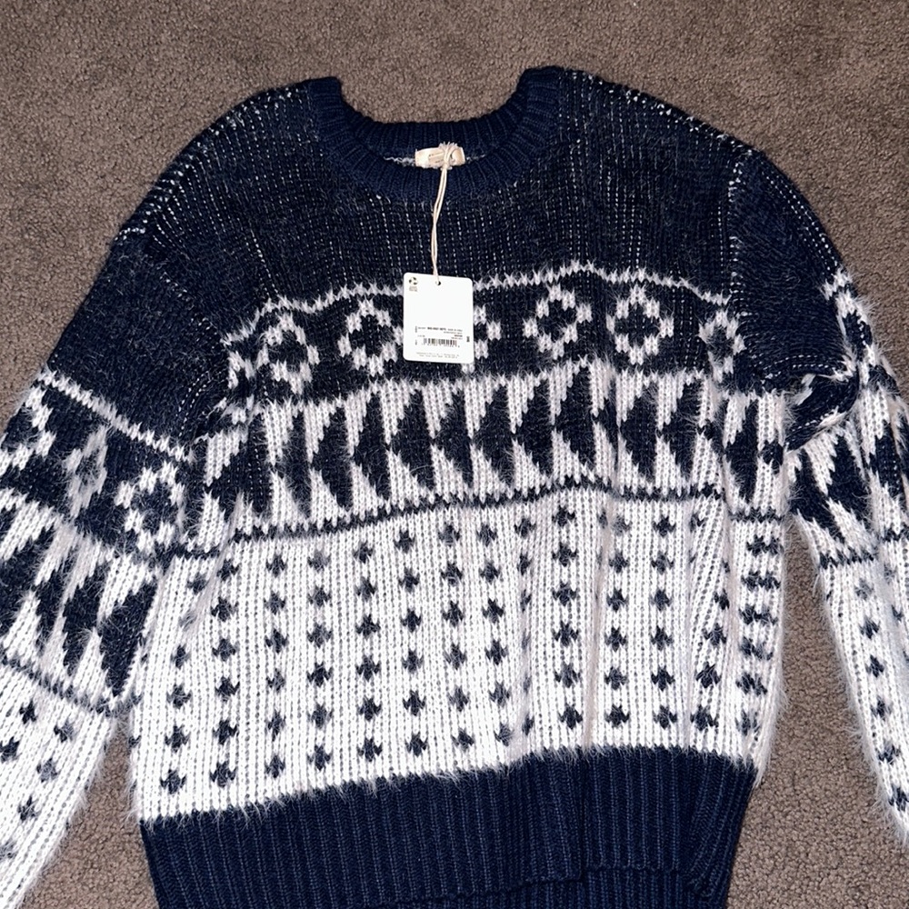 White and navy sweater